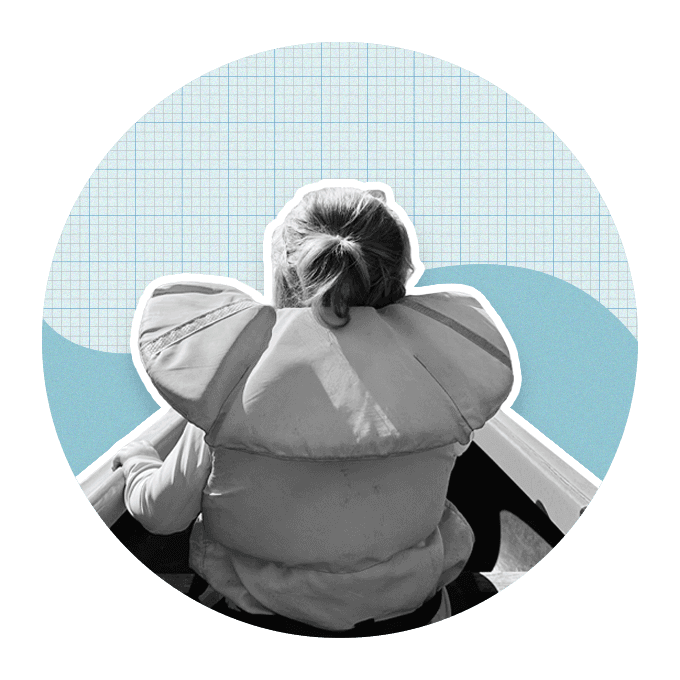 Person safe and protected in life jacket while sitting in a kayak